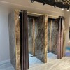 Oppio €67 PER PANEEL - PVC Wandpaneel Milos Bruin Hoogglans - 120x280x0,3 cm